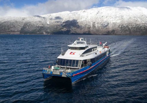 What should a boat do when meeting a ferry?